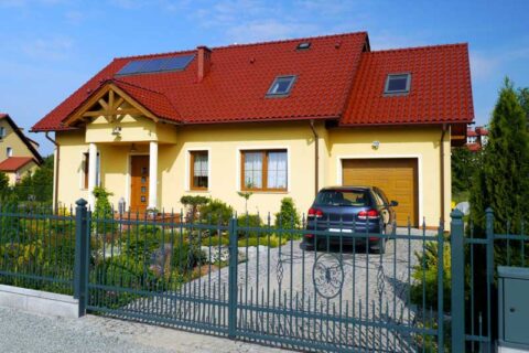 Yellow residential dwelling with red roof in Poland